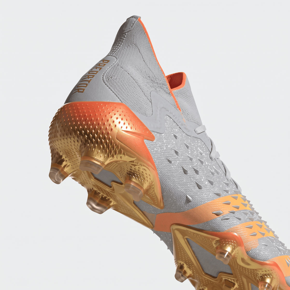 Predator Freak.1 FG Silver Metallic / Core Black / Team Solar Orange